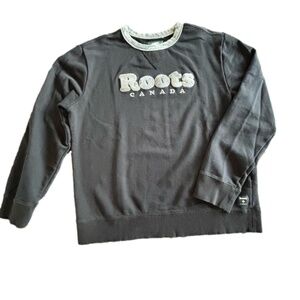 Roots unisex black crew neck sweatshirt with light camo trim and chenille logo